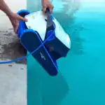 Dolphin S300 robotic pool cleaner front view|Dolphin S300 scrubbing brushes close-up|Dolphin S300 top-load filter access|Dolphin S300 cleaning pool waterline|Dolphin S300 MyDolphin Plus app spot cleaning|Dolphin S300 navigating pool wall