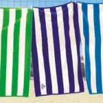 FatTowels cabana stripe beach towel in variety of colors|FatTowels cabana stripe towel color options|FatTowels cabana stripe towel draped on lounge chair