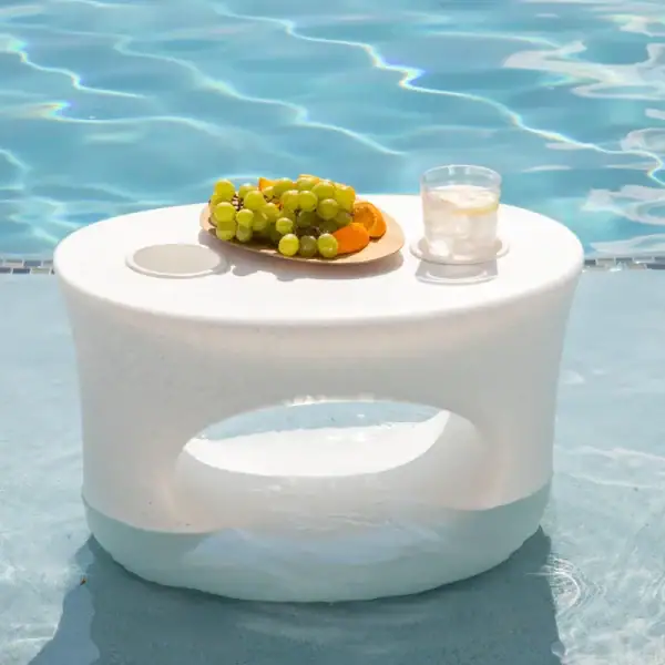 Tenjam Amped in-pool side table in white granite on sun shelf|Tenjam Amped table poolside lifestyle|Tenjam Amped table with Moon Chair in pool|Tenjam Woosah chairs with Amped table|Tenjam Amped table in yellow in pool|Tenjam Amped table as stool|Tenjam Moon Chair pair with Amped table|Tenjam Amped table dimensions