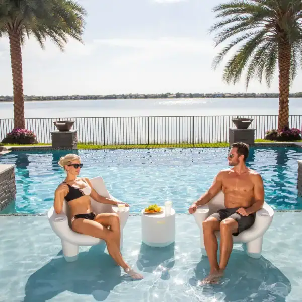 Tenjam Mibster in-pool chair white granite with Ripple table|Tenjam Mibster chairs yellow on patio|Tenjam Mibster chair rendering|Tenjam Mibster chair gray granite mountain view|Tenjam Mibster chair gray granite close-up|Tenjam Mibster chairs in pool with Amped table