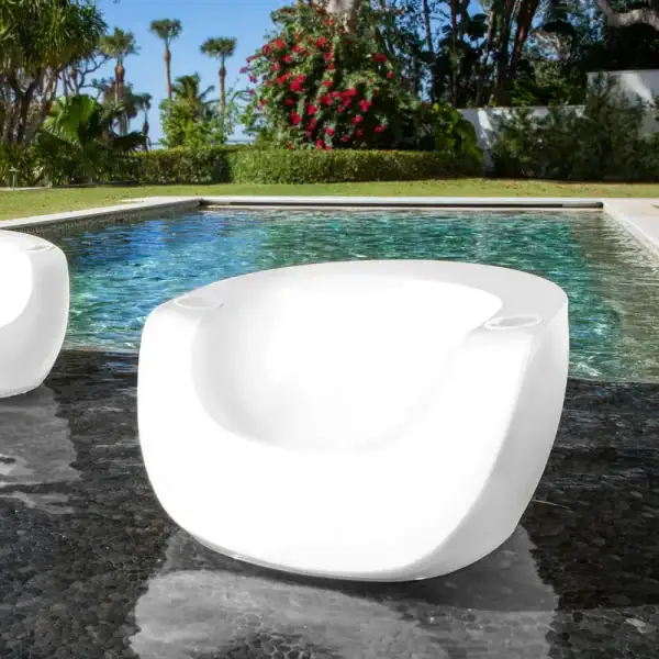 Tenjam Moon in-pool chair white rendering|Tenjam Moon chair with Amped table white granite|Tenjam Moon chair with Dash bench|Tenjam Moon chairs yellow in pool|Tenjam Moon chair on patio evening|Tenjam Moon chairs with people in pool|Tenjam Moon chair with Ripple table white granite