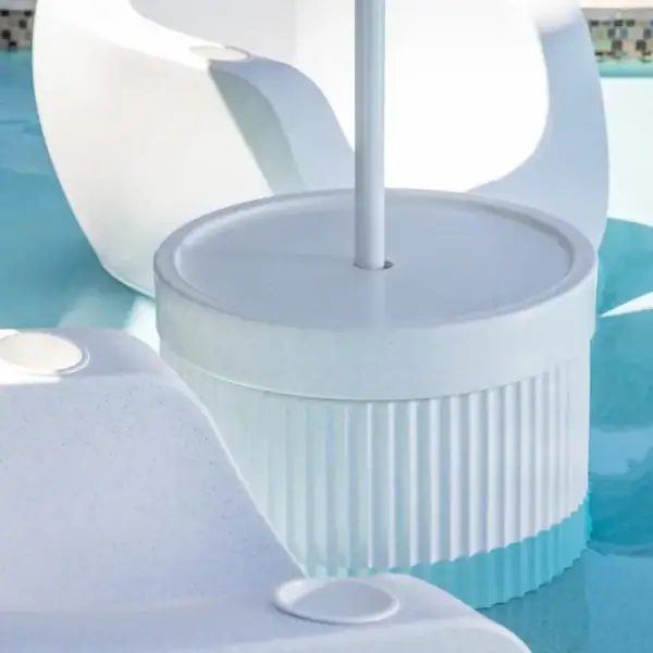 Tenjam Ripple Wide table with Moon Chair white granite in pool|Tenjam Ripple Wide table with Woosah chair poolside|Tenjam Ripple Wide table patio setting|Tenjam Ripple Wide table showing optional umbrella hole