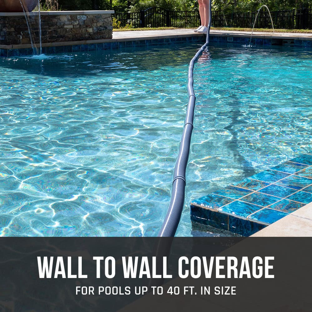 A pool vacuum hose stretches across a swimming pool, showing wall to wall coverage for pools up to 40 ft.
