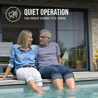 A smiling couple relaxes by a pool, with text: "QUIET OPERATION from NY pool supplies. YOU MIGHT FORGET IT'S THERE.