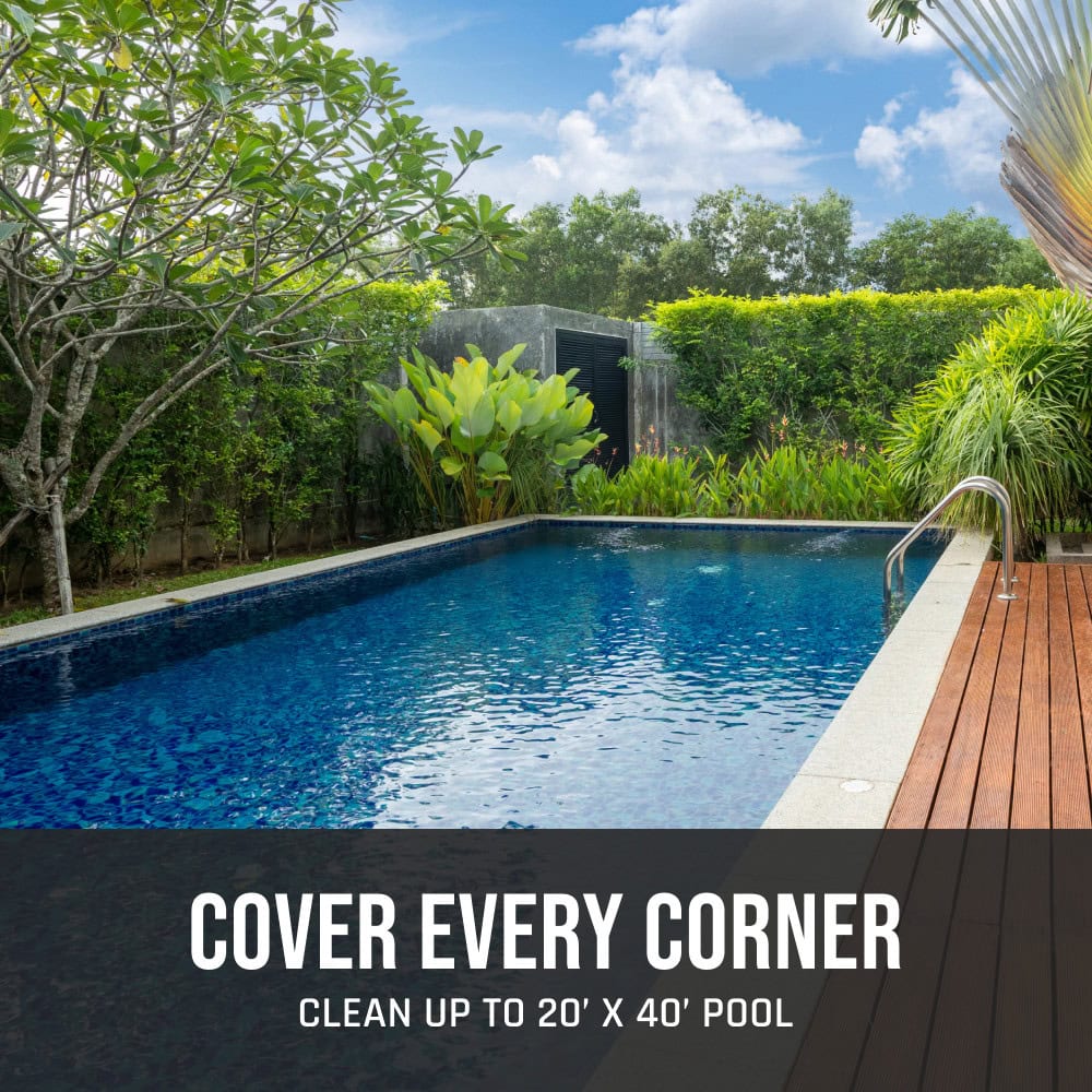 A rectangular backyard pool surrounded by greenery promoting cleaning coverage for up to 20' x 40' pools.