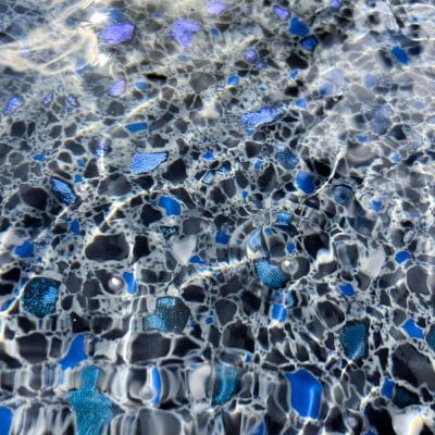 Midnight Opal tile displays iridescent purple hues, perfect for pools in Long Island and Queens, NY.