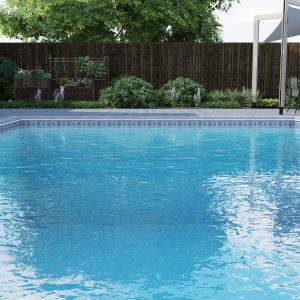 A sparkling pool features Celestial Stone/Island Clouds tiles, creating a blue oasis in Long Island.