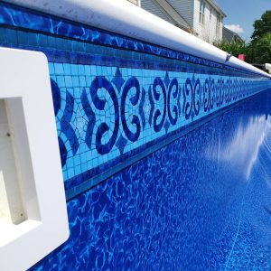 Close-up of Morro Bay Floor pool liner showcasing a Marco Island decorative tile pattern from Long Island.