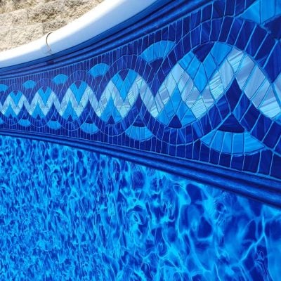 The Royal Island Tile Sea Storm Floor pool liner features a blue geometric mosaic design from NY pool supplies.
