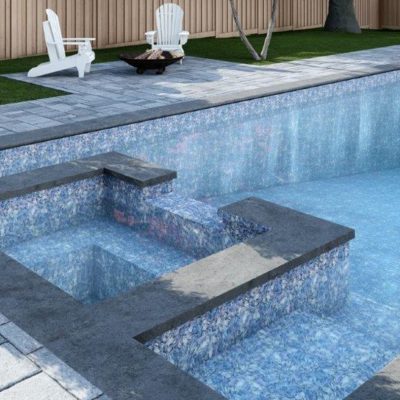 Moonstone Bay features a modern backyard pool with built-in spa, fire pit, and Adirondack chairs.
