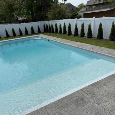 A modern pool with Caswell Beach Tile and Sandy Point Floor, ideal for Long Island & Queens, NY spaces.