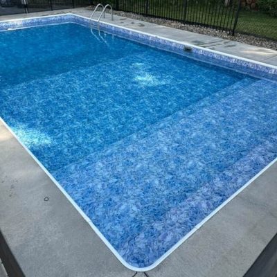 Moonstone Bay features a clear blue pool with a ladder, perfect for summer in Long Island & Queens, NY.