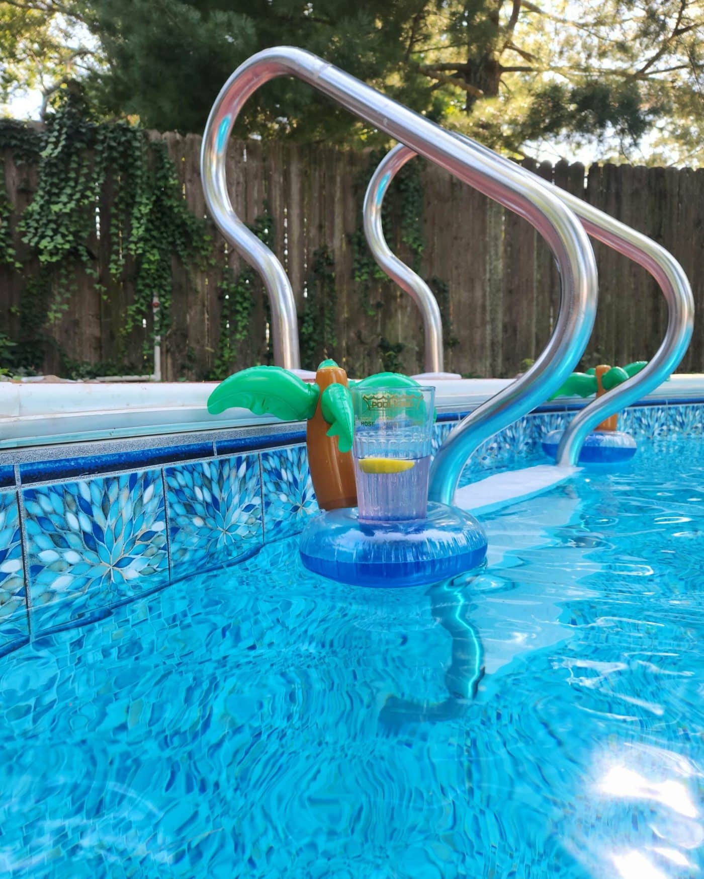 A sparkling poolside features an Aster Tile/Ocean Breeze Floor, available in Long Island and Queens, NY.