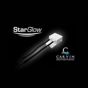 Small white Carvin StarGlow LED Pool Light (9413612001) with two black wires on a solid black background.