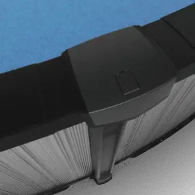 Close-up of Ember Drift 27' round resin above ground pool with textured edge and clear blue water inside.